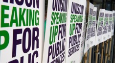 UNISON speaking up for public services placards tied to railing
