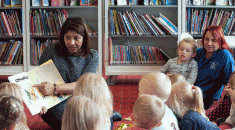 Library worker Shazzia Rock reads to a group of children