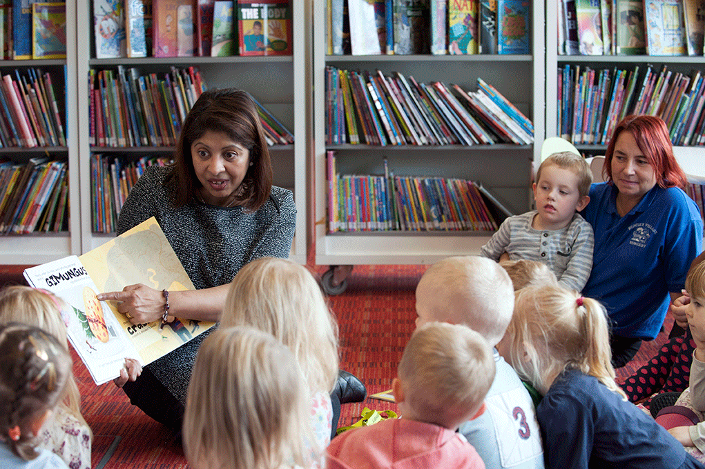 Library worker Shazzia Rock reads to a group of children
