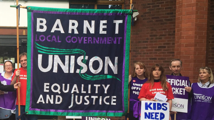 General secretary Dave Prentis with striking members and the Barnet UNISON banner outside The Library, in Barnet, north London
