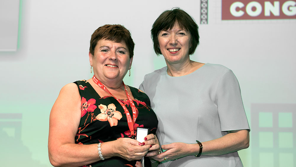 Margaret McKee receiving the TUC Gold medal from TUC general secretary Frances O'Grady