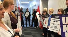 UNISON and Unite members line a corridor as part of a protest against pension changes at Hull university