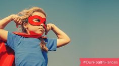 photo of young girl in mask and cape alongisde social media tag #ourhealthheroes