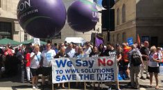 strikers on the 30 June march with placards, banner and balloons