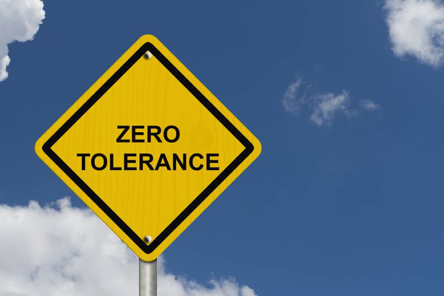 Zero Tolerance Warning Sign An American road warning sign with words Zero Tolerance with blue sky