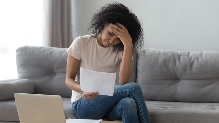 Stressed Woman Holding Bills Worried About Bankruptcy Ba