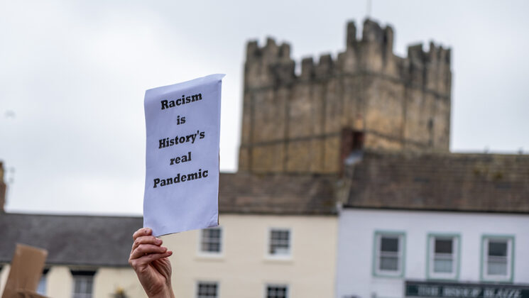 anti-racism message being held by Black hand in Richmond, Yorkshire