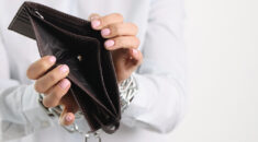 woman's hands holding empty purse