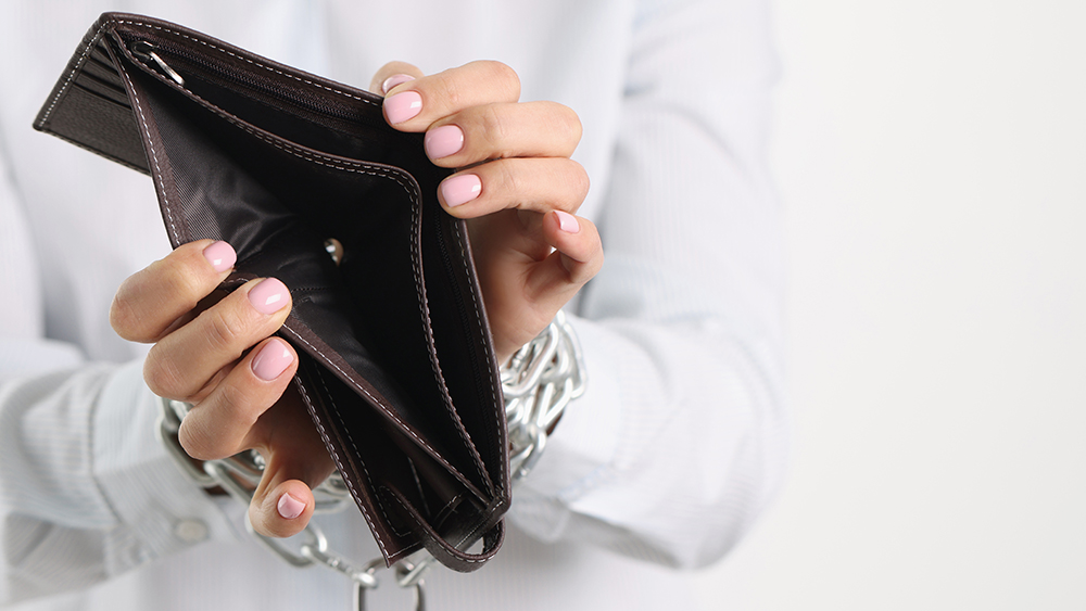woman's hands holding empty purse