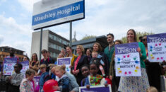 Health workers and their children protesting outside the hospital