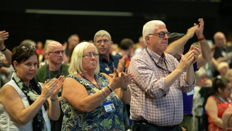 Delegates clapping at National delegate conference