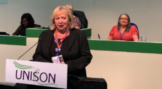 Christina McAnea in a black top and black jacket, dressing UNISON's national disabled members; conference