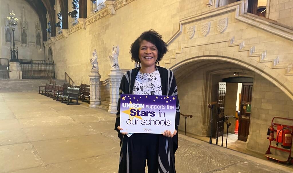 Chi Onwurah, MP for Newcastle Central, in Westminster Hall holding a stars in our schools placard