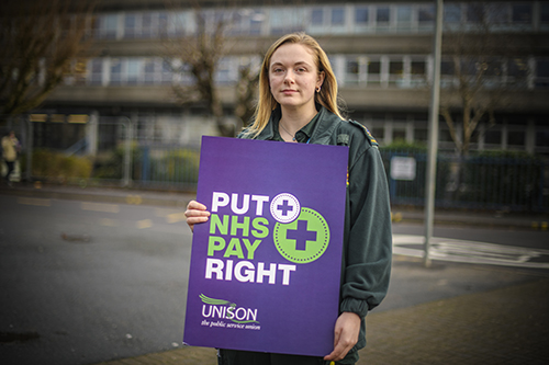 Email ambulance striker with UNISON placard saying 'Put pay right'