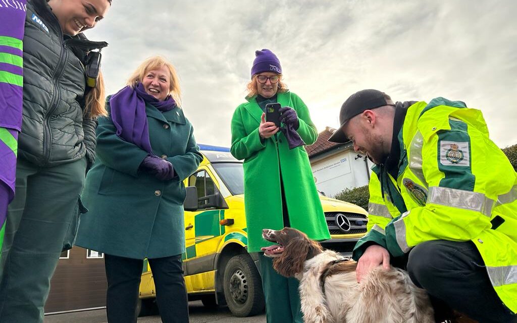 Christina McAnea (second from left) and Jo Kaye (Second from the right) on a picket line in the wouth west with two ambulance members and a springer spaniel.