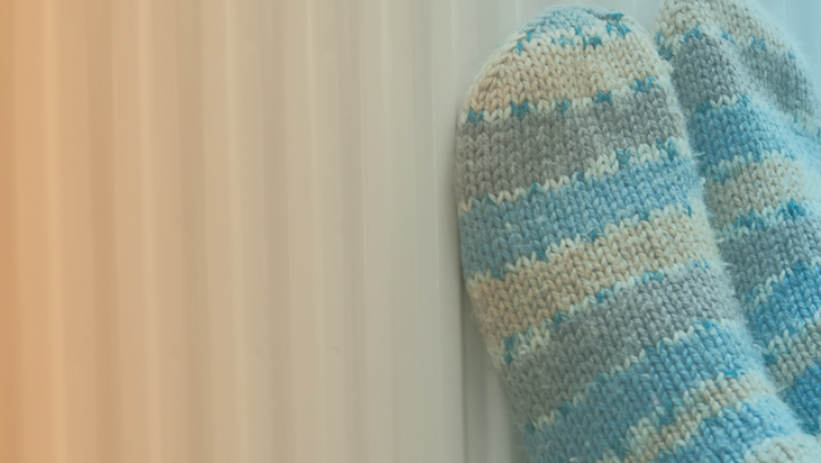 Knitted socks on a warm radiator